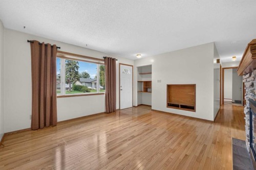 4639 Marbank Drive, Calgary, AB - Indoor Photo Showing Other Room With Fireplace
