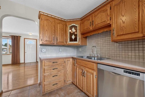 4639 Marbank Drive, Calgary, AB - Indoor Photo Showing Kitchen With Double Sink