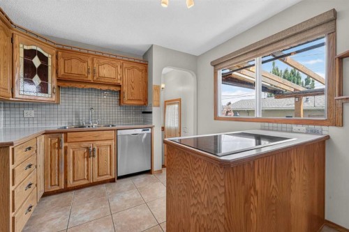 4639 Marbank Drive, Calgary, AB - Indoor Photo Showing Kitchen With Double Sink