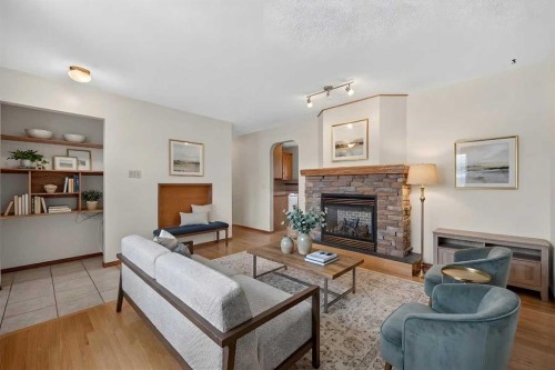 4639 Marbank Drive, Calgary, AB - Indoor Photo Showing Living Room With Fireplace
