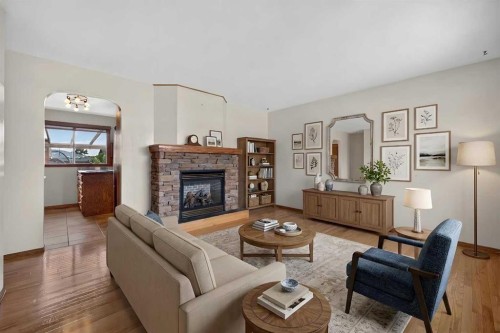 4639 Marbank Drive, Calgary, AB - Indoor Photo Showing Living Room With Fireplace