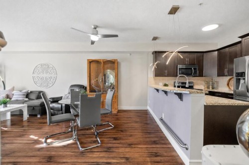 3106-15 Sunset Square, Cochrane, AB - Indoor Photo Showing Kitchen With Upgraded Kitchen