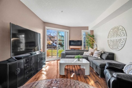 3106-15 Sunset Square, Cochrane, AB - Indoor Photo Showing Living Room