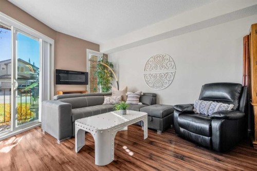 3106-15 Sunset Square, Cochrane, AB - Indoor Photo Showing Living Room