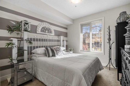 3106-15 Sunset Square, Cochrane, AB - Indoor Photo Showing Bedroom
