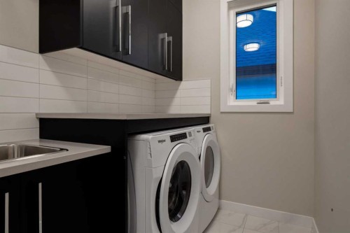 84 Timberline Way Sw, Calgary, AB - Indoor Photo Showing Laundry Room