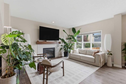 26 Evansfield Park Nw, Calgary, AB - Indoor Photo Showing Living Room With Fireplace