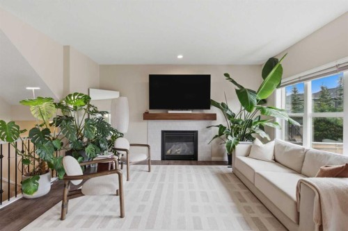 26 Evansfield Park Nw, Calgary, AB - Indoor Photo Showing Living Room With Fireplace