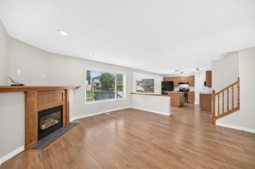 247 Covington Close Ne, Calgary, AB - Indoor Photo Showing Living Room With Fireplace