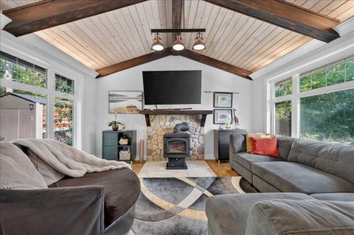 9011 33 Avenue Nw, Calgary, AB - Indoor Photo Showing Living Room With Fireplace