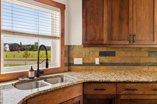 115 Rockmont Court Nw, Calgary, AB - Indoor Photo Showing Kitchen With Double Sink