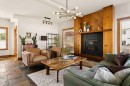 115 Rockmont Court Nw, Calgary, AB  - Indoor Photo Showing Living Room With Fireplace 