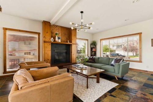 115 Rockmont Court Nw, Calgary, AB - Indoor Photo Showing Living Room With Fireplace