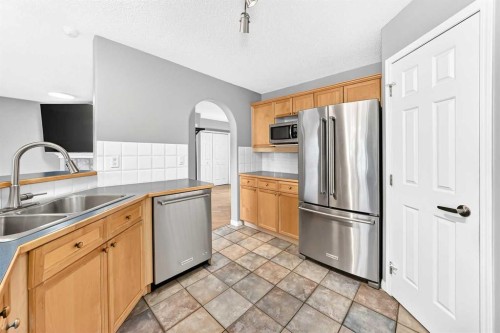 23 Thornbird Way Se, Airdrie, AB - Indoor Photo Showing Kitchen With Double Sink