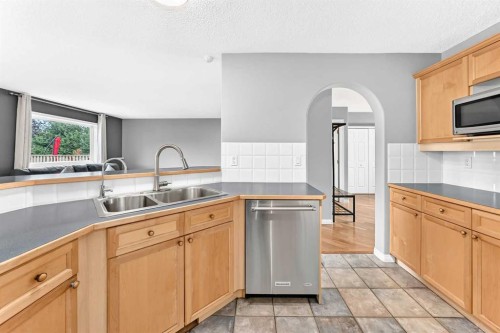 23 Thornbird Way Se, Airdrie, AB - Indoor Photo Showing Kitchen With Double Sink