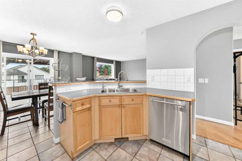 23 Thornbird Way Se, Airdrie, AB - Indoor Photo Showing Kitchen With Double Sink
