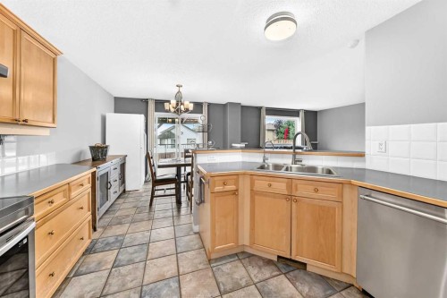 23 Thornbird Way Se, Airdrie, AB - Indoor Photo Showing Kitchen With Double Sink