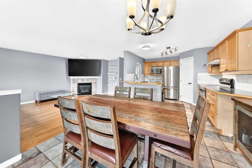 23 Thornbird Way Se, Airdrie, AB - Indoor With Fireplace