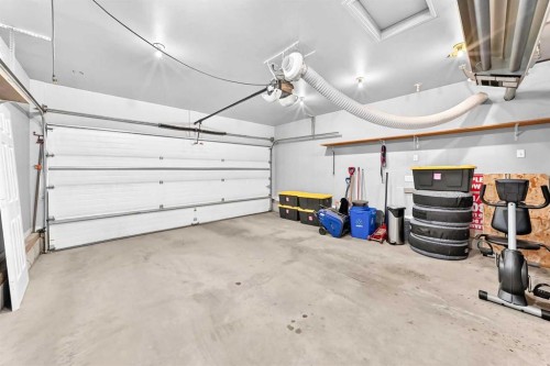 23 Thornbird Way Se, Airdrie, AB - Indoor Photo Showing Garage