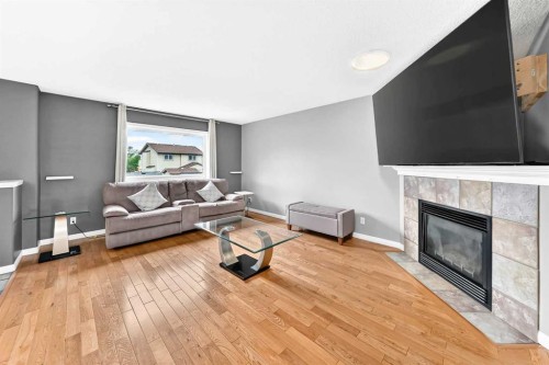 23 Thornbird Way Se, Airdrie, AB - Indoor With Fireplace