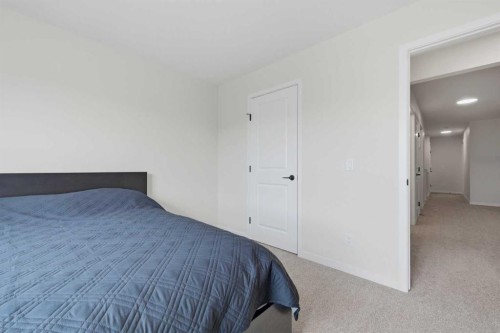 147 Magnolia Path Se, Calgary, AB - Indoor Photo Showing Bedroom