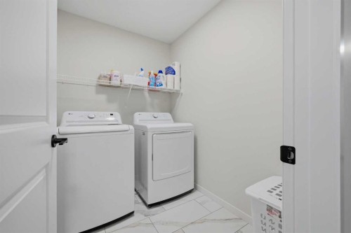147 Magnolia Path Se, Calgary, AB - Indoor Photo Showing Laundry Room