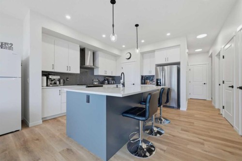 147 Magnolia Path Se, Calgary, AB - Indoor Photo Showing Kitchen With Upgraded Kitchen