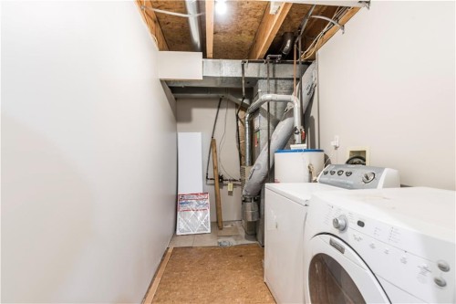 1019 Smith Avenue, Crossfield, AB - Indoor Photo Showing Laundry Room