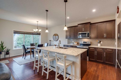 150 Fireside Bend, Cochrane, AB - Indoor Photo Showing Kitchen With Upgraded Kitchen