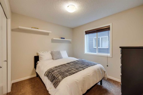 150 Fireside Bend, Cochrane, AB - Indoor Photo Showing Bedroom