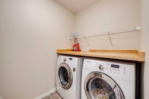 150 Fireside Bend, Cochrane, AB - Indoor Photo Showing Laundry Room