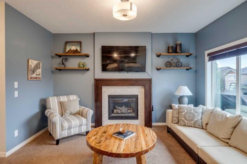 150 Fireside Bend, Cochrane, AB - Indoor Photo Showing Living Room With Fireplace