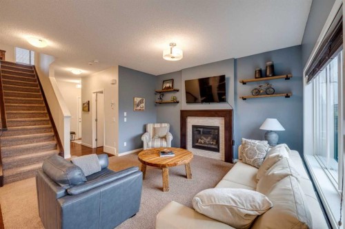 150 Fireside Bend, Cochrane, AB - Indoor Photo Showing Living Room With Fireplace