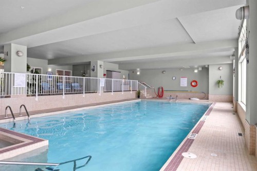 225-15 Everstone Drive Sw, Calgary, AB - Indoor Photo Showing Other Room With In Ground Pool