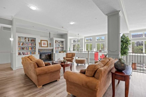 225-15 Everstone Drive Sw, Calgary, AB - Indoor Photo Showing Living Room With Fireplace