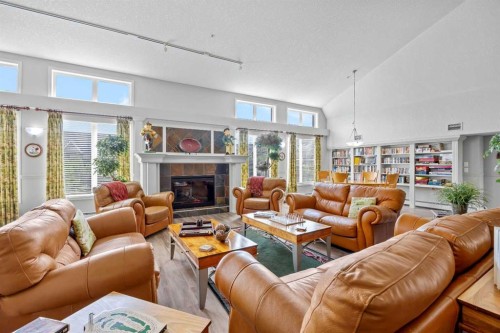 225-15 Everstone Drive Sw, Calgary, AB - Indoor Photo Showing Living Room With Fireplace