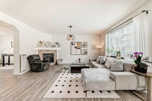 169 Aspenshire Drive Sw, Calgary, AB - Indoor Photo Showing Living Room With Fireplace