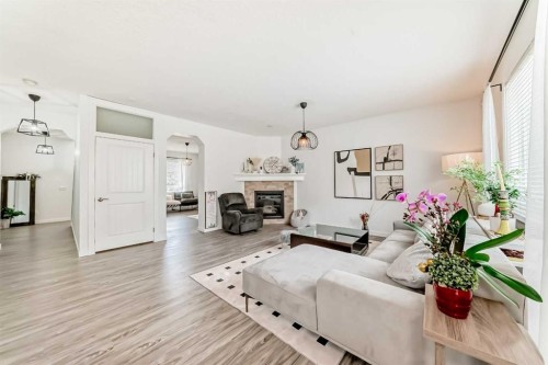 169 Aspenshire Drive Sw, Calgary, AB - Indoor Photo Showing Living Room With Fireplace