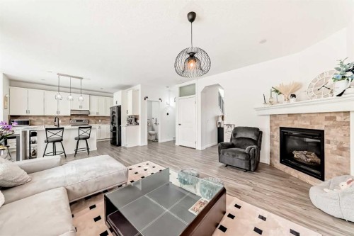 169 Aspenshire Drive Sw, Calgary, AB - Indoor Photo Showing Living Room With Fireplace