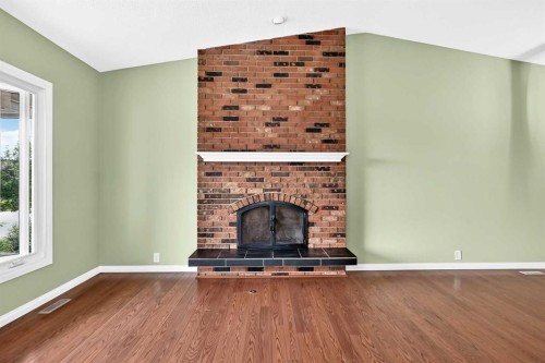11335 Braeside Drive Sw, Calgary, AB - Indoor With Fireplace
