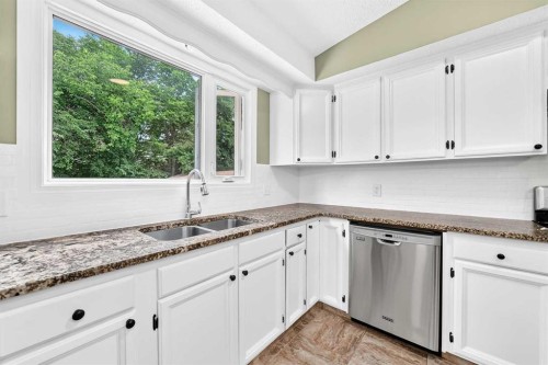 11335 Braeside Drive Sw, Calgary, AB - Indoor Photo Showing Kitchen With Double Sink