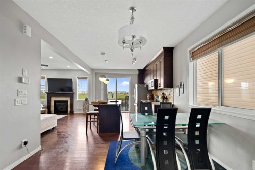 259 Cityscape Gardens Ne, Calgary, AB - Indoor Photo Showing Dining Room With Fireplace