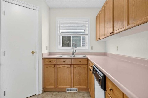 67 Rivercrest Circle Se, Calgary, AB - Indoor Photo Showing Kitchen With Double Sink
