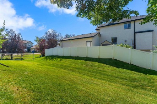6-156 Canoe Drive Sw, Airdrie, AB - Outdoor With Backyard