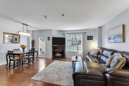 6-156 Canoe Drive Sw, Airdrie, AB - Indoor Photo Showing Living Room With Fireplace