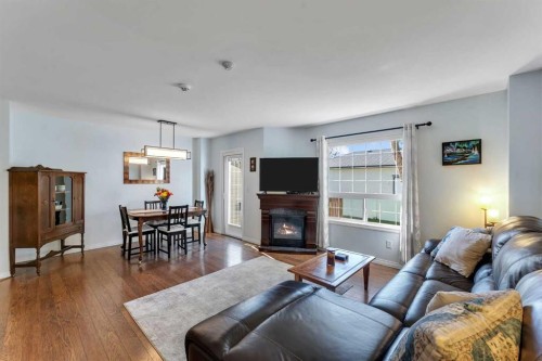 6-156 Canoe Drive Sw, Airdrie, AB - Indoor Photo Showing Living Room With Fireplace