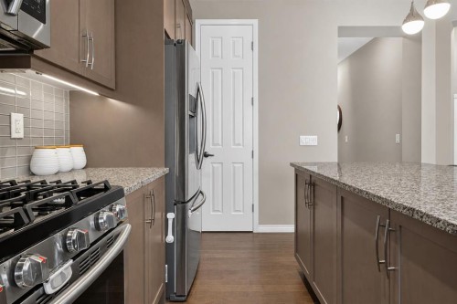 150 Osborne Rise Sw, Airdrie, AB - Indoor Photo Showing Kitchen With Stainless Steel Kitchen With Upgraded Kitchen