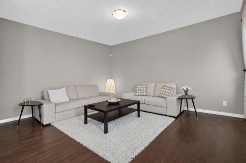150 Osborne Rise Sw, Airdrie, AB - Indoor Photo Showing Living Room