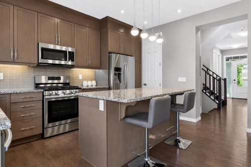 150 Osborne Rise Sw, Airdrie, AB - Indoor Photo Showing Kitchen With Stainless Steel Kitchen With Upgraded Kitchen