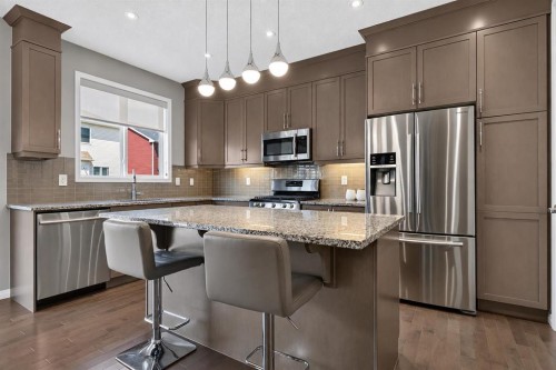 150 Osborne Rise Sw, Airdrie, AB - Indoor Photo Showing Kitchen With Stainless Steel Kitchen With Upgraded Kitchen